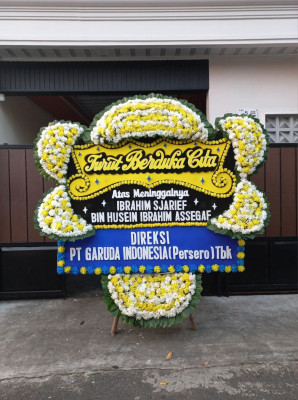 Papan Bunga Duka di Tapian Nauli